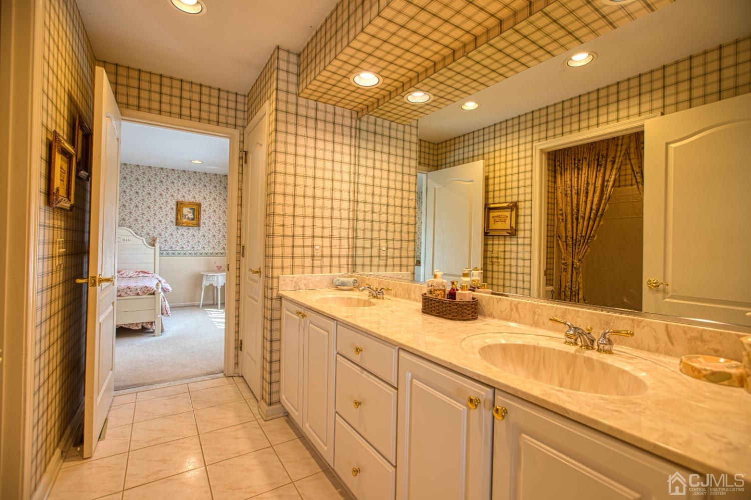 17 Grovers Mill Road Plainsboro, NJ 08536 - Photo 59 of 69 a bathroom with a sink a mirror and a shower