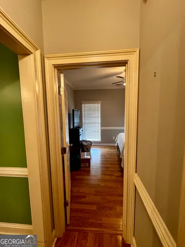 a view of living room with furniture and wooden floor