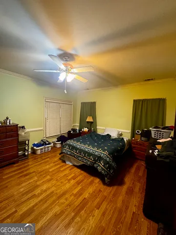 a bed room with a bed furniture and a computer