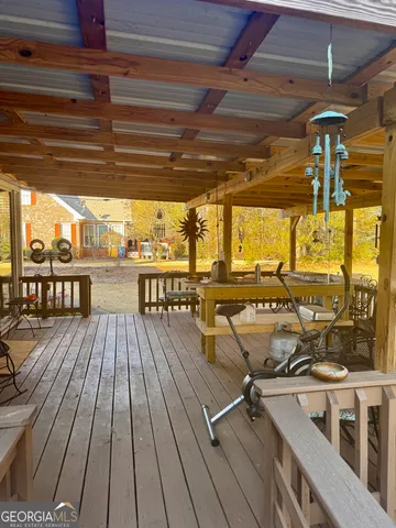 a view of a balcony with wooden floor