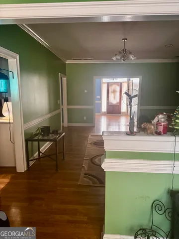 a view of dining room with furniture and chandelier
