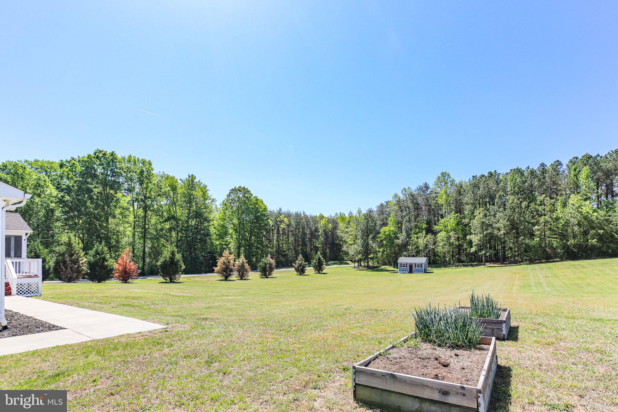 33 Austin Way Bumpass, VA 23024 - Photo 24 of 55 a view of a lake with a yard