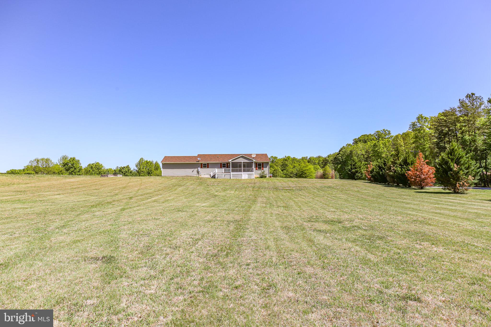 33 Austin Way Bumpass, VA 23024 - Photo 27 of 55 a large body of water with a building in the background