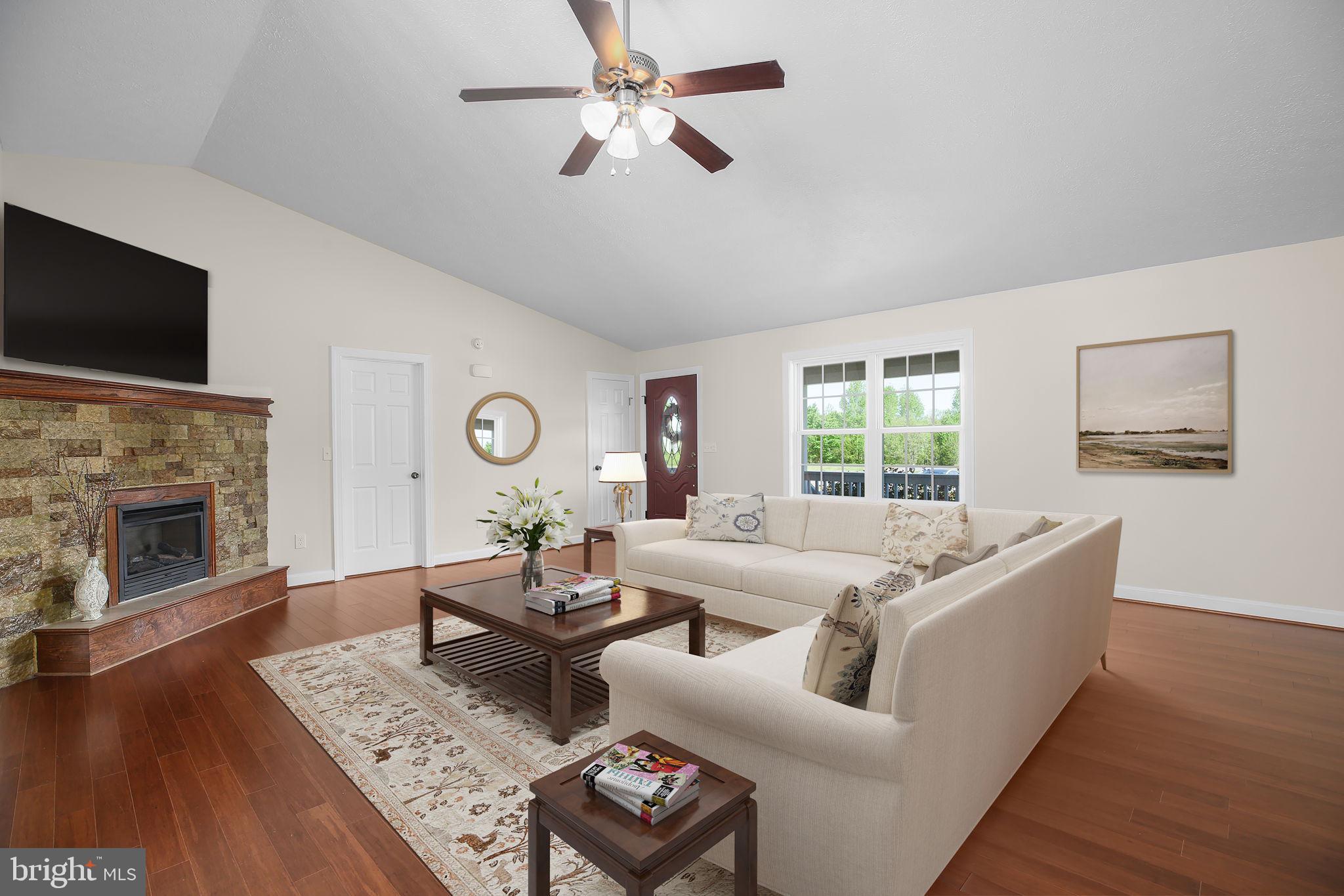 33 Austin Way Bumpass, VA 23024 - Photo 3 of 55 a living room with furniture and a fireplace