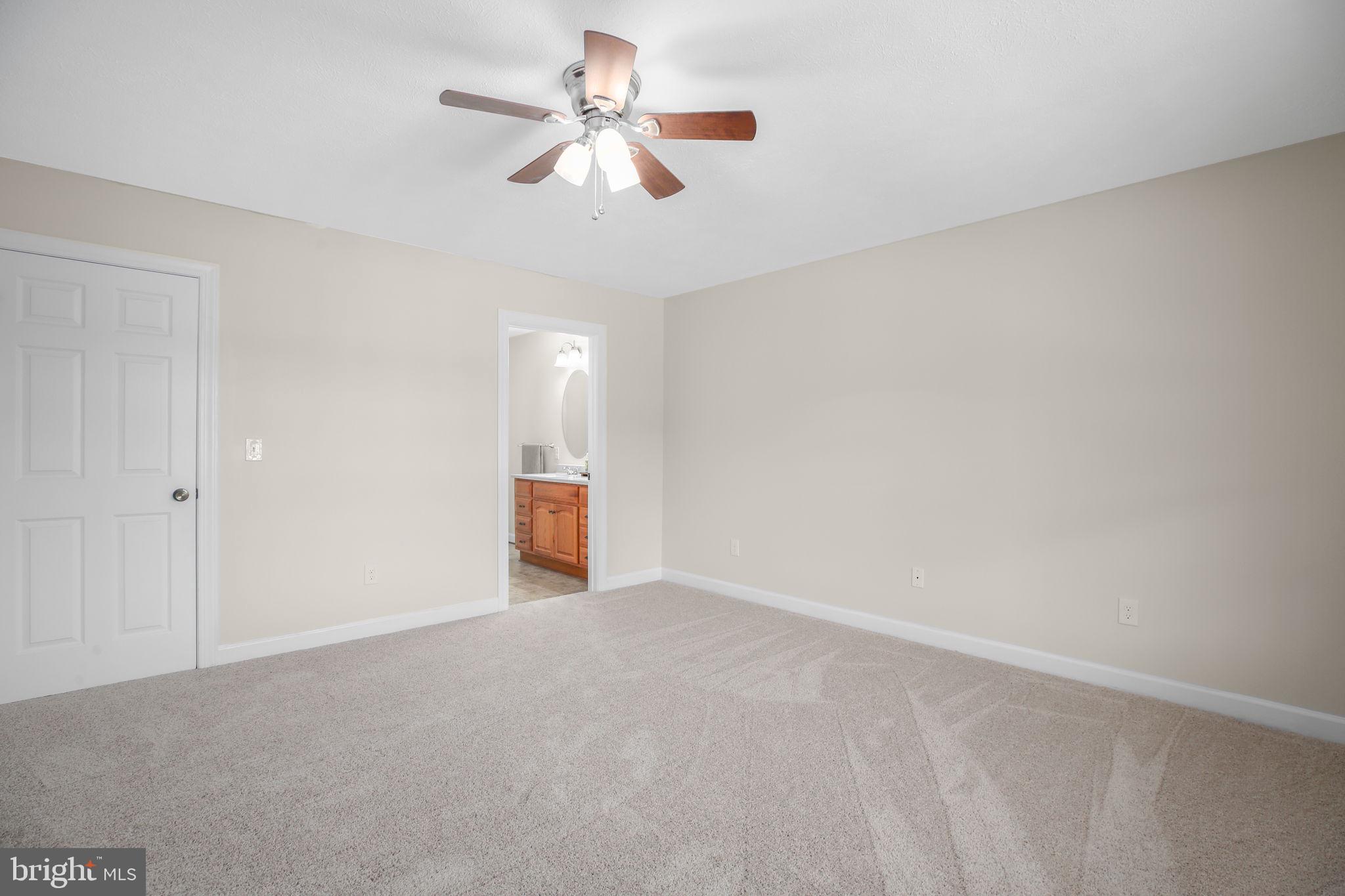 33 Austin Way Bumpass, VA 23024 - Photo 46 of 55 a view of an empty room with a ceiling fan