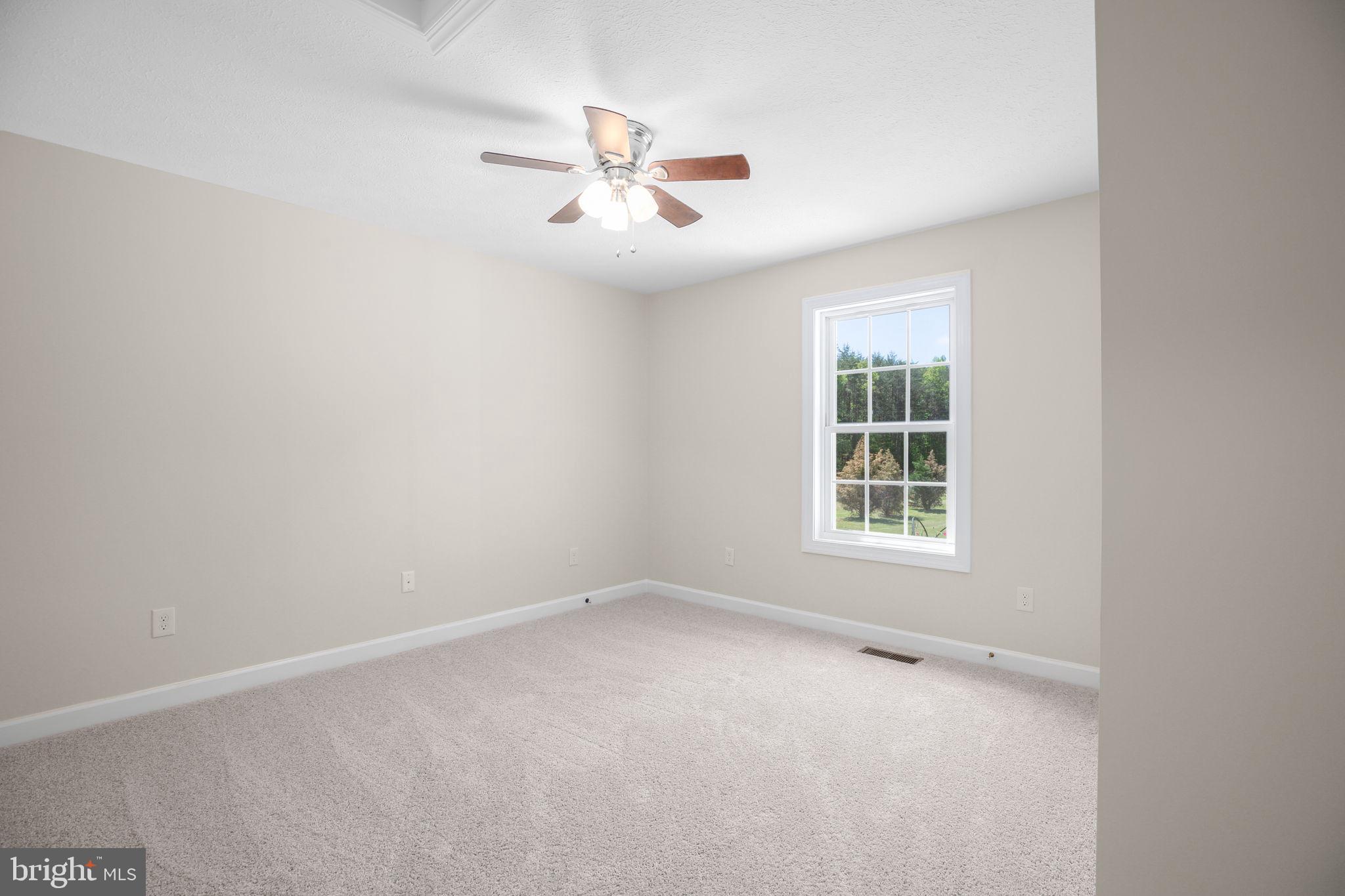 33 Austin Way Bumpass, VA 23024 - Photo 53 of 55 an empty room with windows and fan