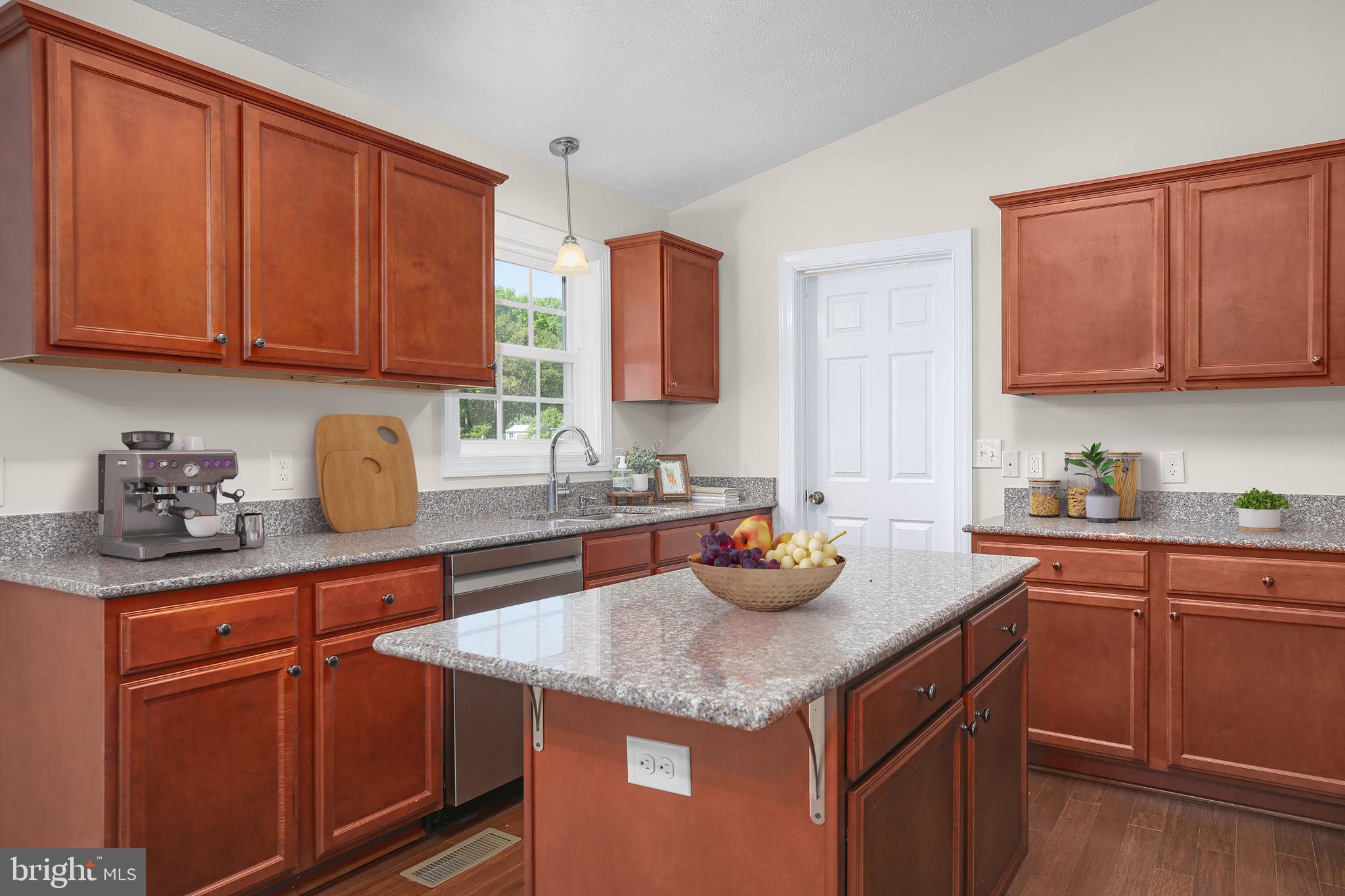 33 Austin Way Bumpass, VA 23024 - Photo 7 of 55 a kitchen with stainless steel appliances granite countertop a sink a stove and cabinets