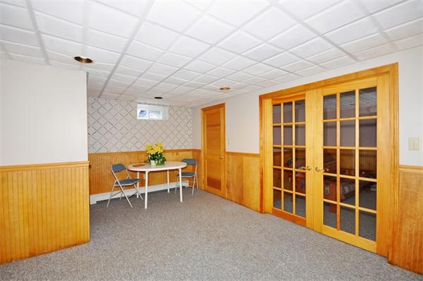 7 Senator Road Woburn, MA 01801 - Photo 17 of 26 a view of a livingroom with furniture and window