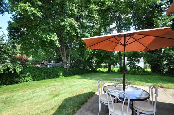 7 Senator Road Woburn, MA 01801 - Photo 19 of 26 a view of a chair and table in the garden