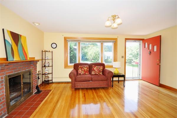 7 Senator Road Woburn, MA 01801 - Photo 4 of 26 a living room with furniture and a fireplace