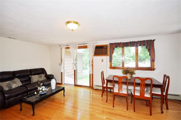 7 Senator Road Woburn, MA 01801 - Photo 8 of 26 a living room with furniture and wooden floor