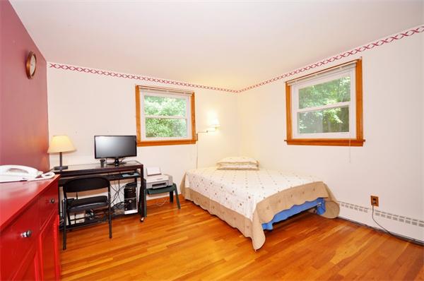 7 Senator Road Woburn, MA 01801 - Photo 9 of 26 a bedroom with a bed and a window