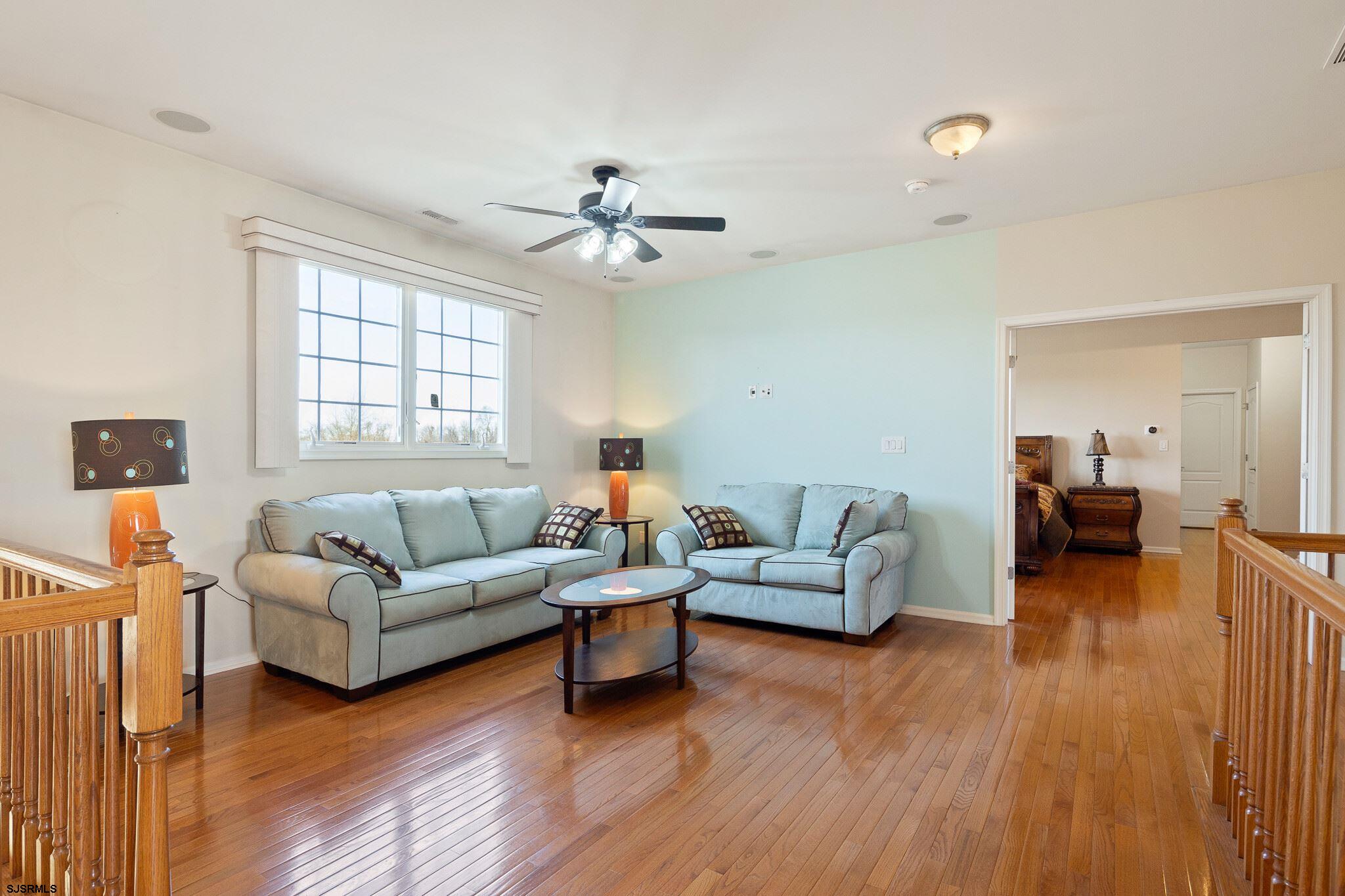 175 Greenview Court Clarksboro, NJ 08020 - Photo 16 of 25 a living room with furniture and a wooden floor