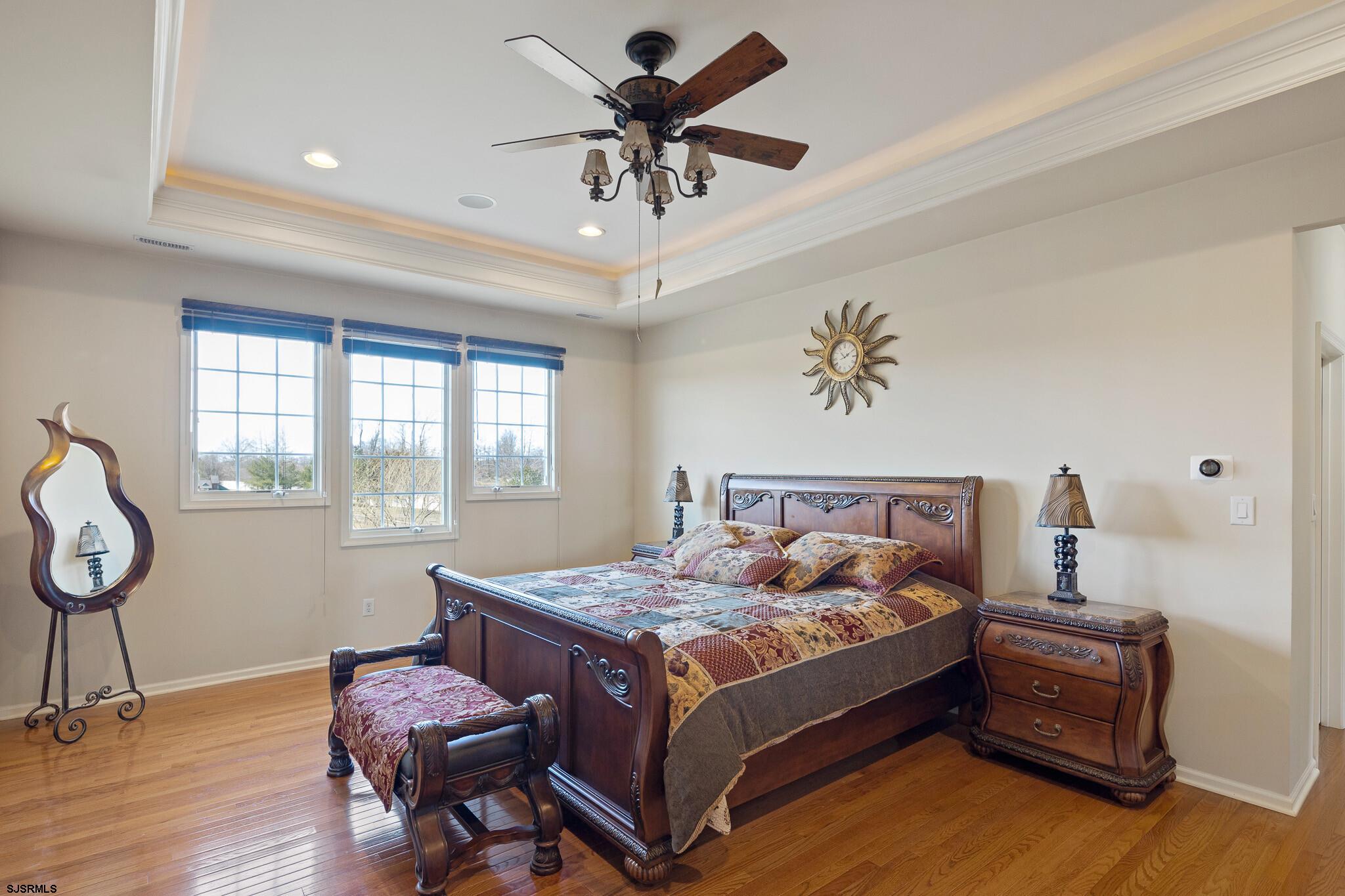 175 Greenview Court Clarksboro, NJ 08020 - Photo 18 of 25 a bed room with a bed and a chandelier