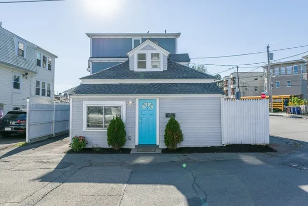 a front view of a house with garage