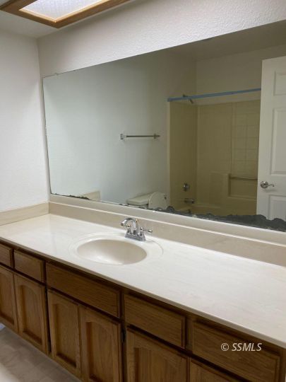 718 North Inyo Street Ridgecrest, CA 93555 - Photo 5 of 9 a bathroom with a sink and a mirror