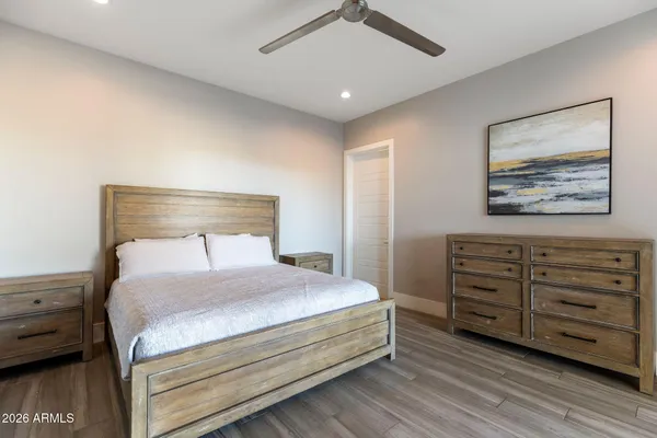 a living room with lots of furniture and white appliances