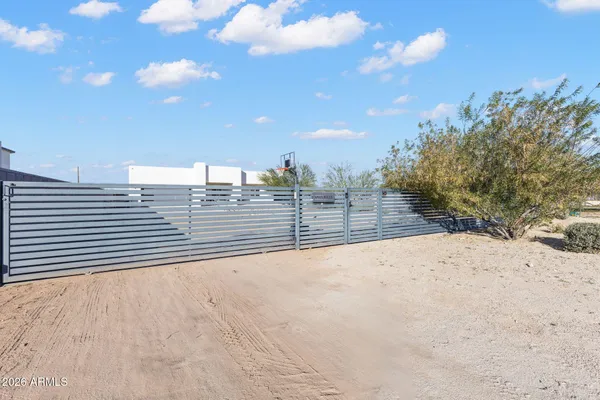 a living room with furniture and a dining table with wooden floor