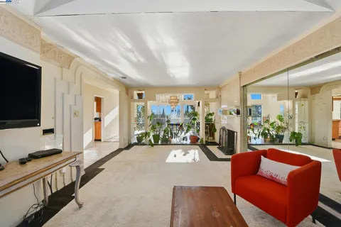 a view of a living room and a livingroom with furniture