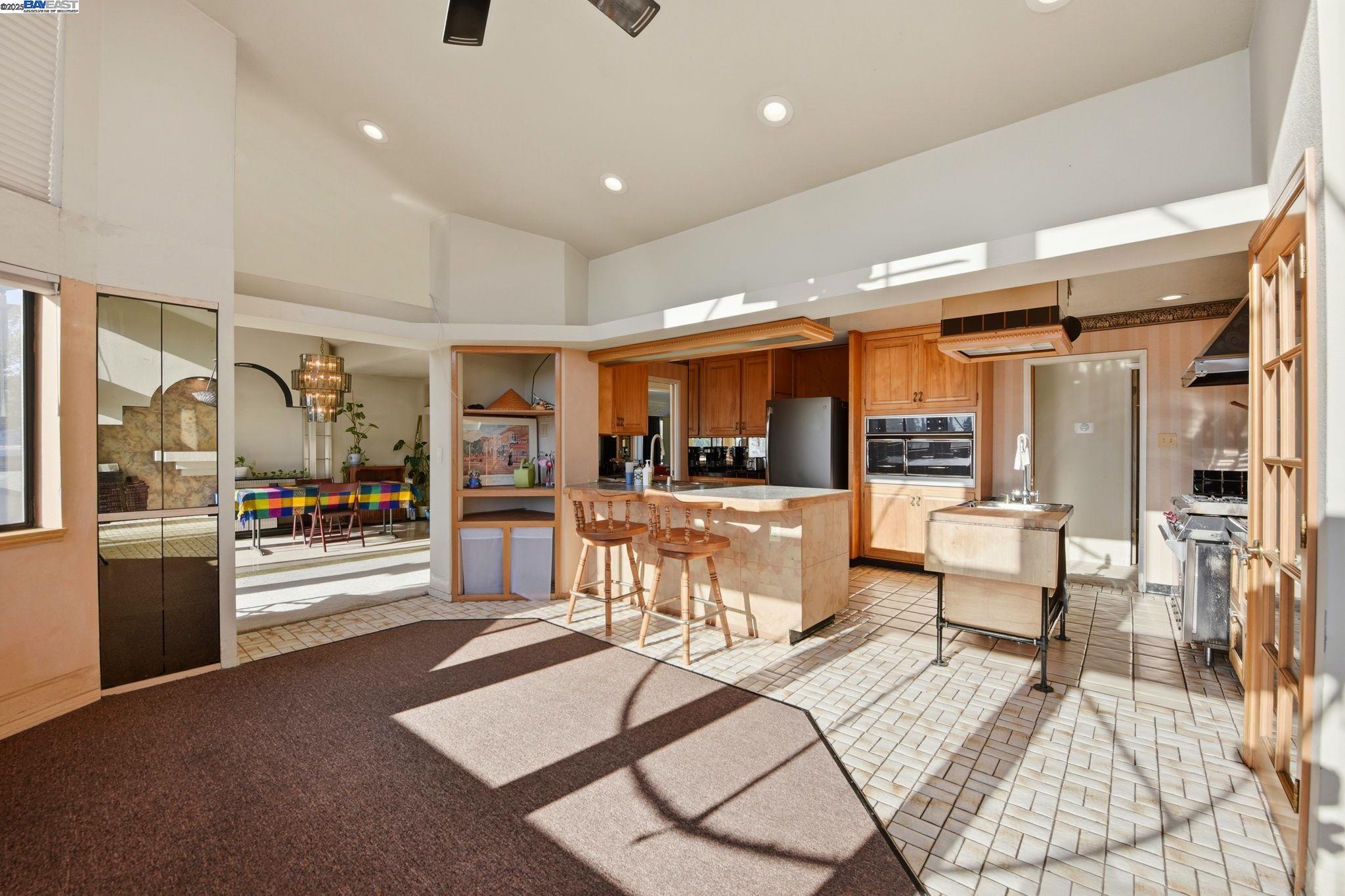 29673 Holiday Street Hayward, CA 94544 - Photo 17 of 47 a living room with furniture and a view of kitchen