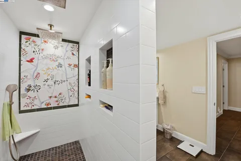 a spacious bathroom with a double vanity sink a mirror and a