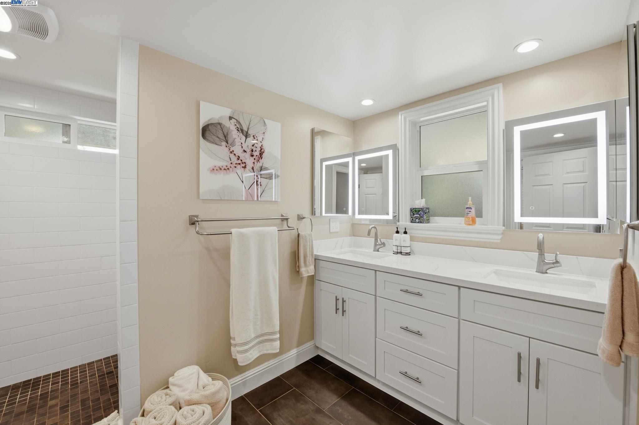 29673 Holiday Street Hayward, CA 94544 - Photo 37 of 47 a spacious bathroom with a double vanity sink a mirror and a