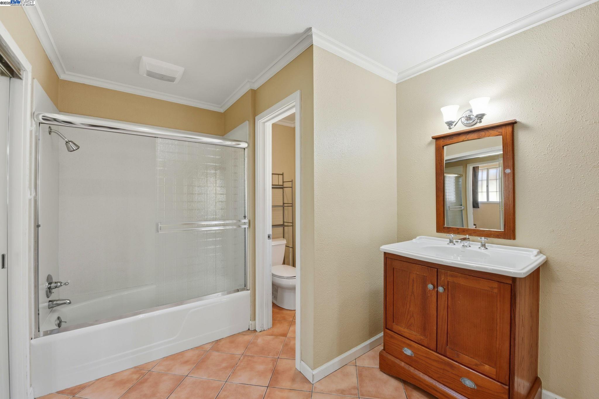 29673 Holiday Street Hayward, CA 94544 - Photo 40 of 47 a bathroom with a shower a mirror and a sink