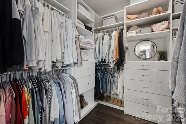 a bedroom with a bed and white walls