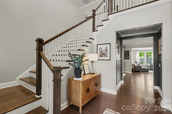 a view of entryway livingroom and hall with wooden floor