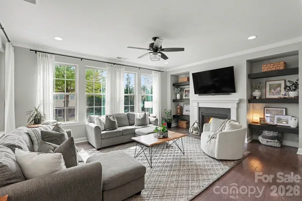 a view of a dining room with furniture and window