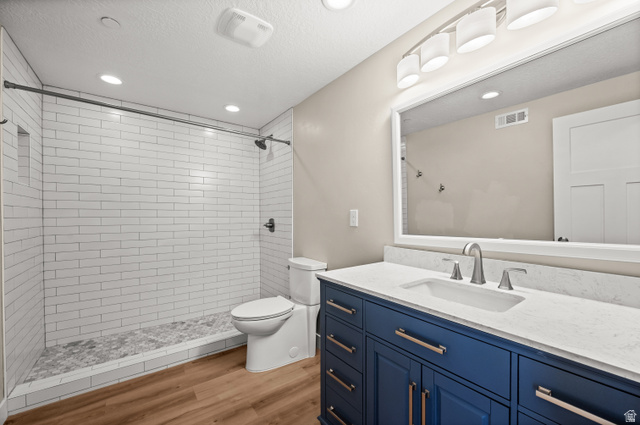 14728 South Canyon Pointe Road Draper, UT 84020 - Photo 29 of 35 Modern bathroom featuring a blue vanity with brushed nickel hardware, a white countertop, and an undermount sink