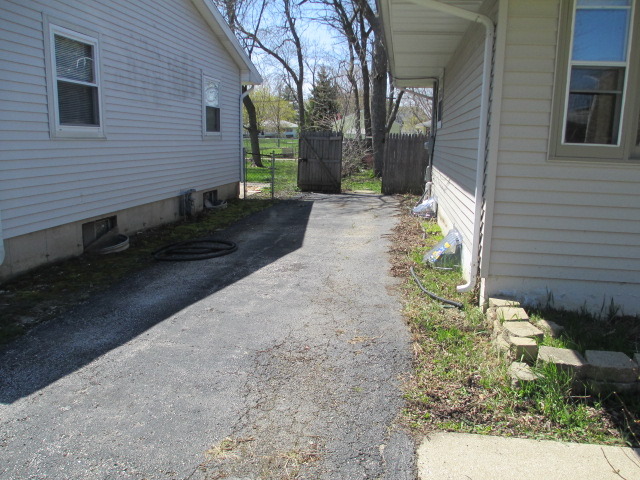 2106 Gideon Avenue Zion, IL 60099 - Photo 20 of 20 a view of a house with a yard
