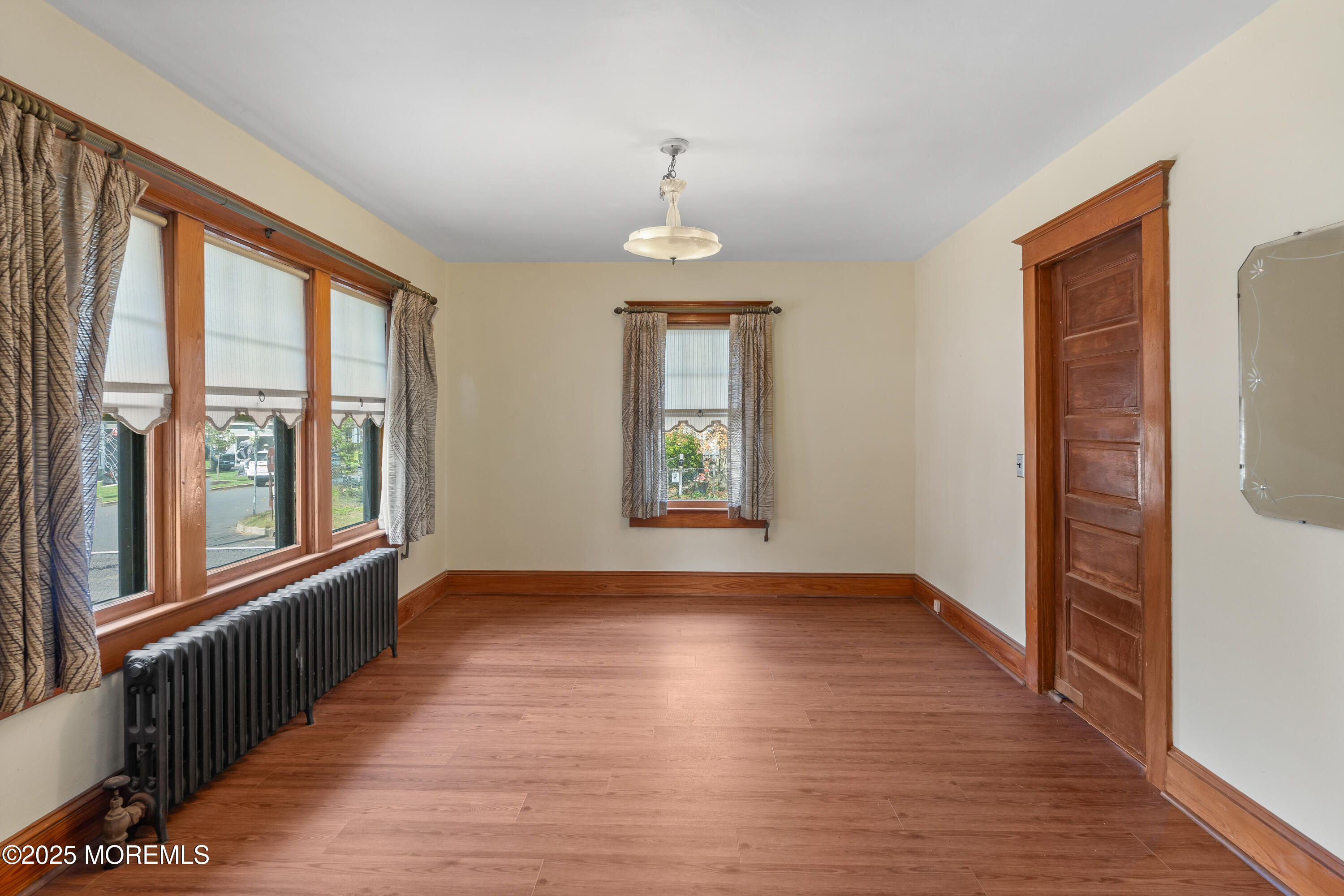 22 Mercer Avenue Port Monmouth, NJ 07758 - Photo 18 of 38 wooden floor in an empty room with a window