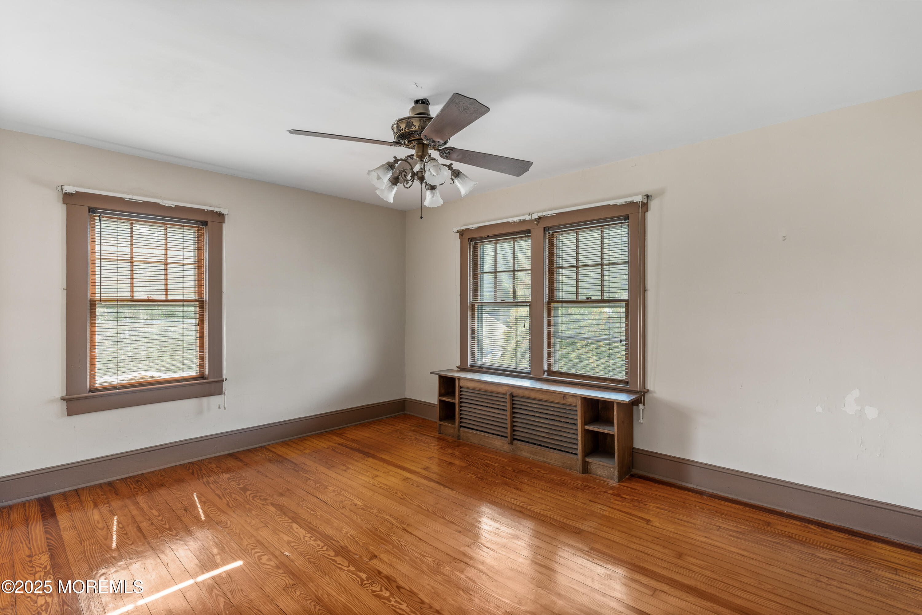 22 Mercer Avenue Port Monmouth, NJ 07758 - Photo 25 of 38 wooden floor in an empty room with a window