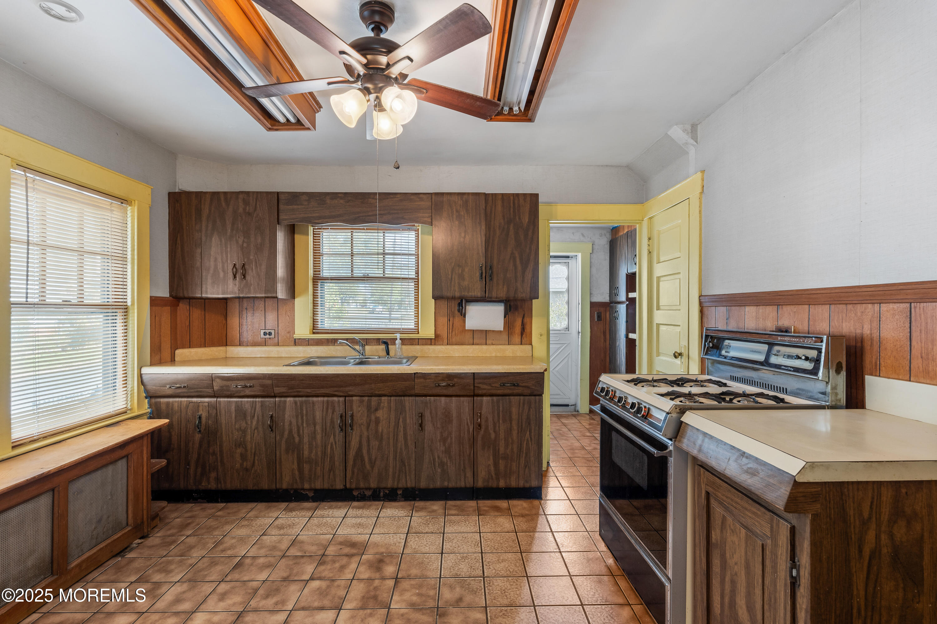 22 Mercer Avenue Port Monmouth, NJ 07758 - Photo 30 of 38 a kitchen with stainless steel appliances granite countertop a stove a sink dishwasher and a refrigerator