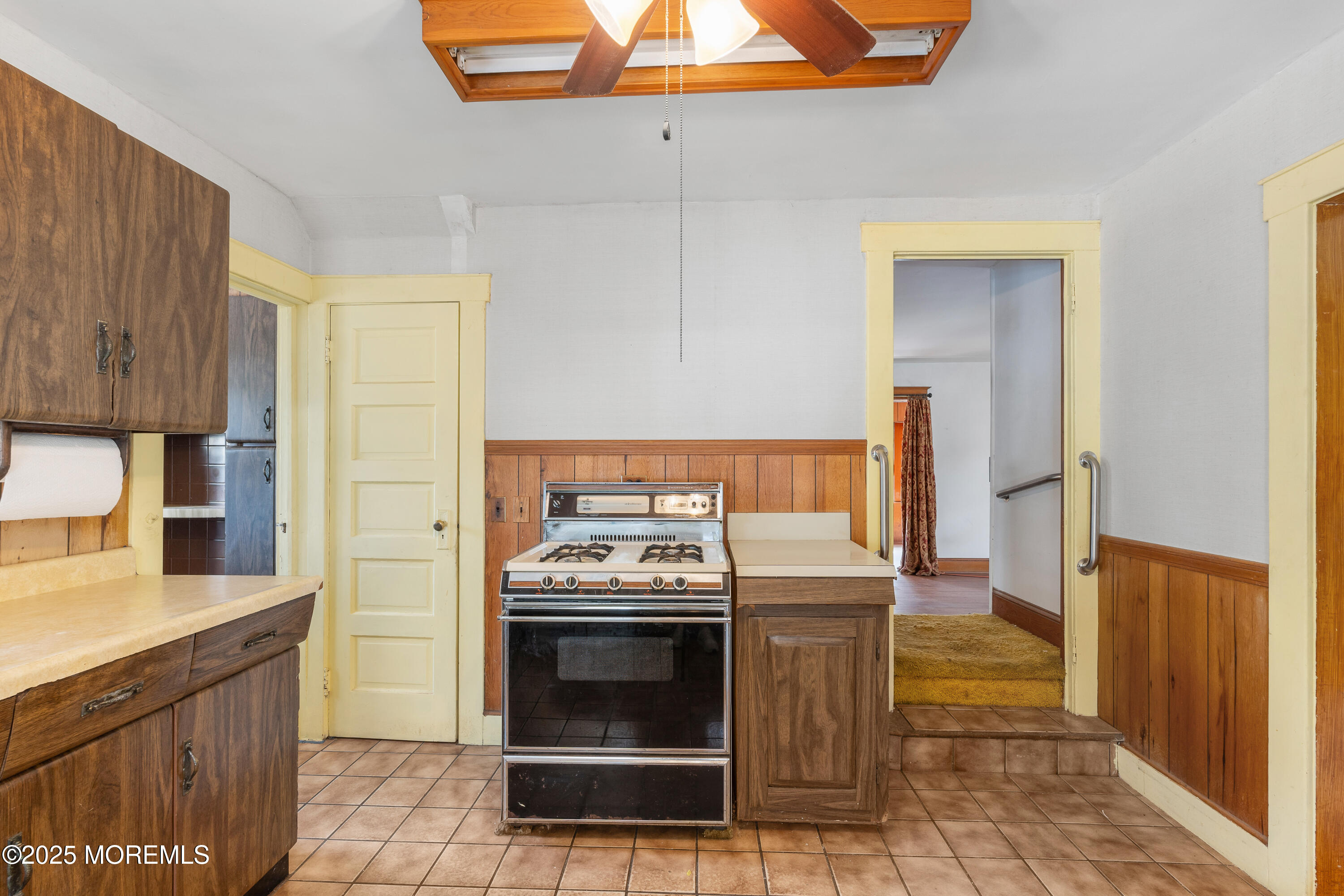 22 Mercer Avenue Port Monmouth, NJ 07758 - Photo 32 of 38 a kitchen with a stove and a refrigerator