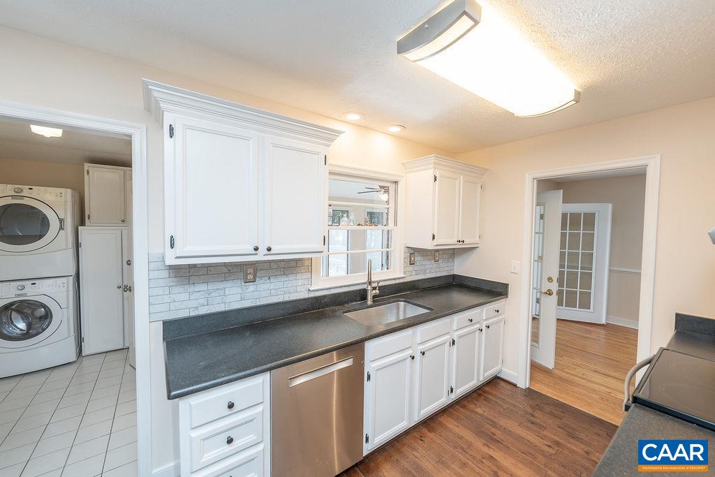 6156 Advance Mills Road Ruckersville, VA 22968 - Photo 13 of 54 a kitchen with granite countertop a sink and cabinets