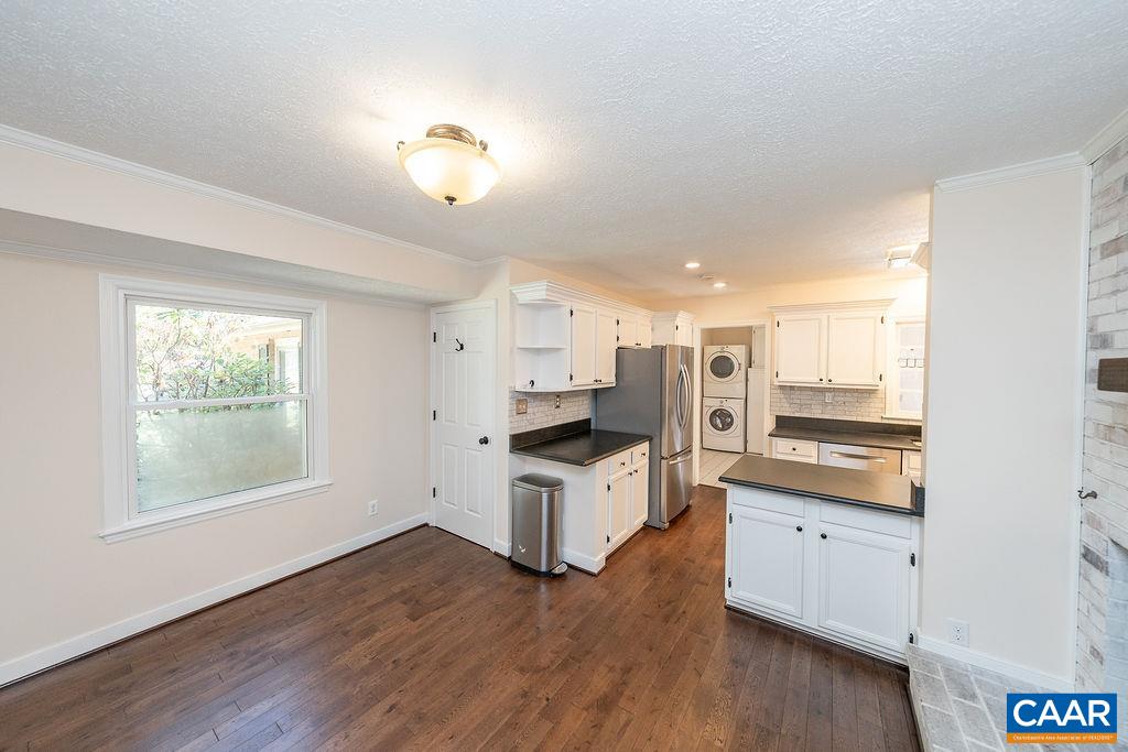 6156 Advance Mills Road Ruckersville, VA 22968 - Photo 14 of 54 a kitchen with granite countertop a stove and wooden floor
