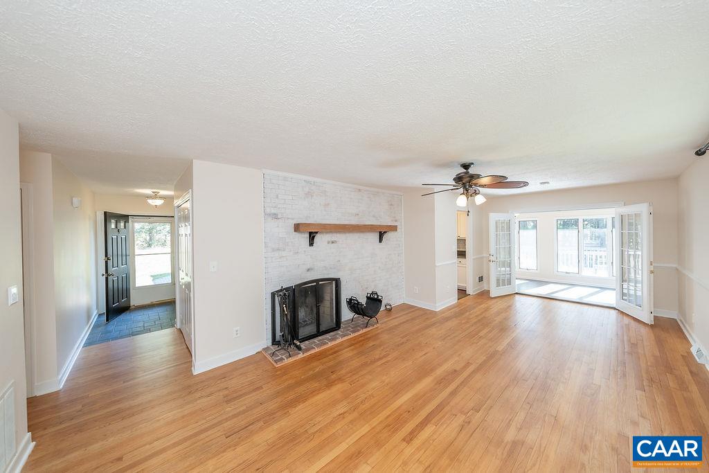 6156 Advance Mills Road Ruckersville, VA 22968 - Photo 2 of 54 wooden floor in an empty room with a window