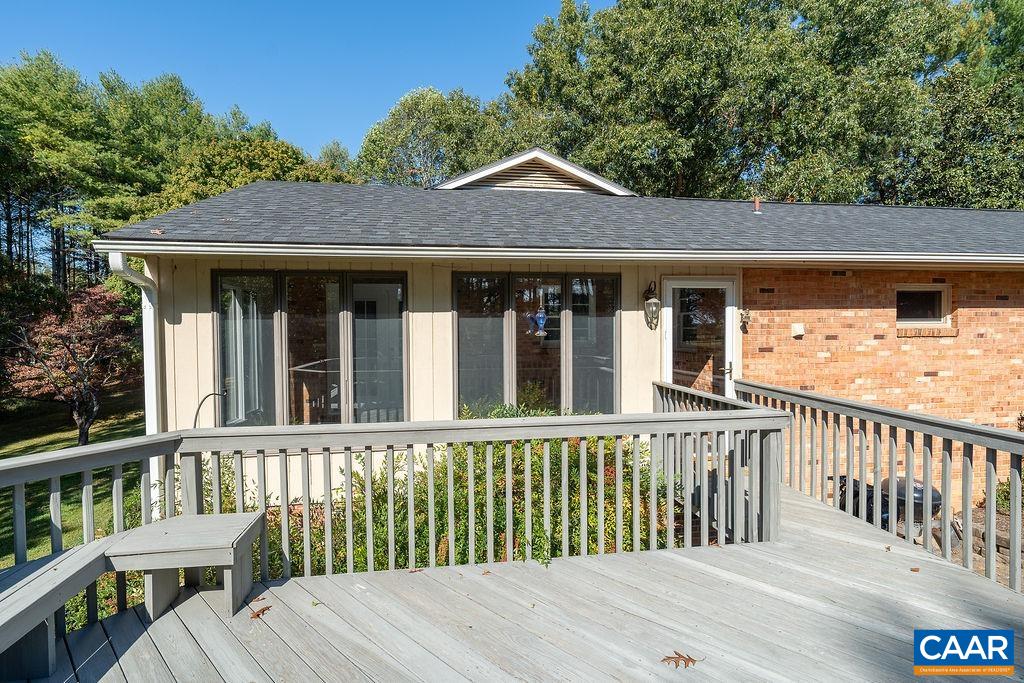 6156 Advance Mills Road Ruckersville, VA 22968 - Photo 29 of 54 a view of a wooden house with a small yard