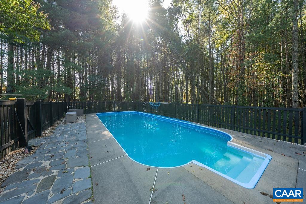 6156 Advance Mills Road Ruckersville, VA 22968 - Photo 32 of 54 a view of a swimming pool with a yard