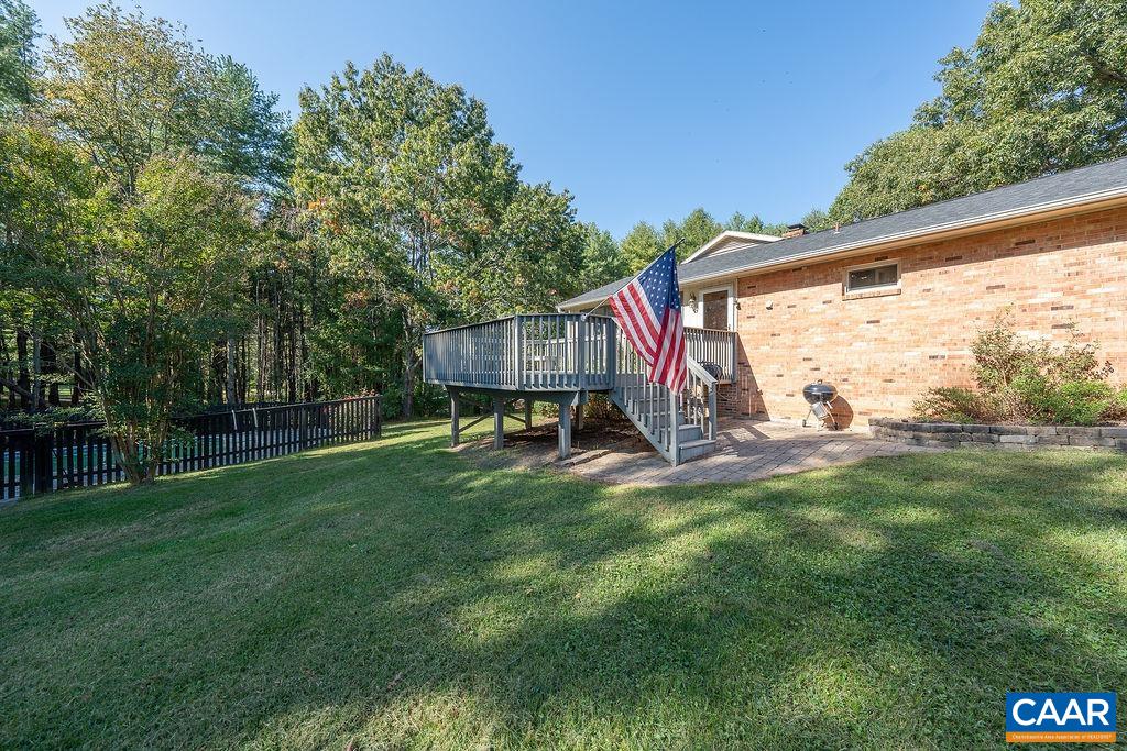 6156 Advance Mills Road Ruckersville, VA 22968 - Photo 35 of 54 a view of a backyard with a garden and entertaining space
