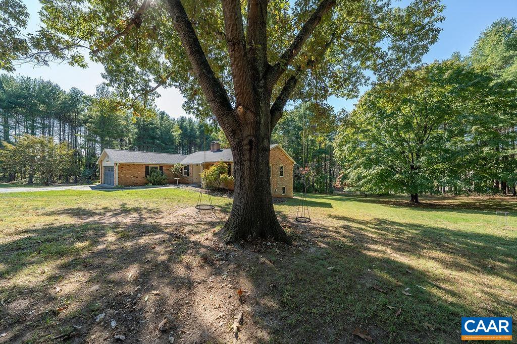 6156 Advance Mills Road Ruckersville, VA 22968 - Photo 36 of 54 a view of a house with a yard