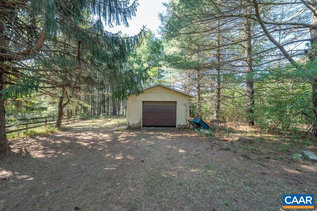 6156 Advance Mills Road Ruckersville, VA 22968 - Photo 41 of 54 a wooden house with large trees and outdoor space