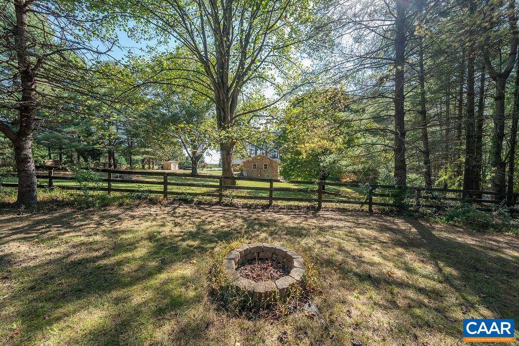 6156 Advance Mills Road Ruckersville, VA 22968 - Photo 42 of 54 a backyard of a house with lots of green space