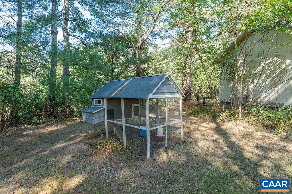 6156 Advance Mills Road Ruckersville, VA 22968 - Photo 43 of 54 a view of a house with a yard balcony and furniture