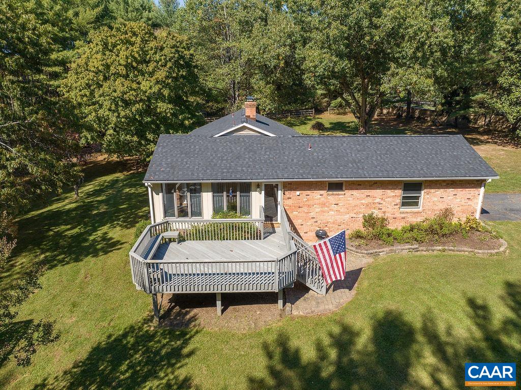 6156 Advance Mills Road Ruckersville, VA 22968 - Photo 44 of 54 a aerial view of a house with a yard table and chairs