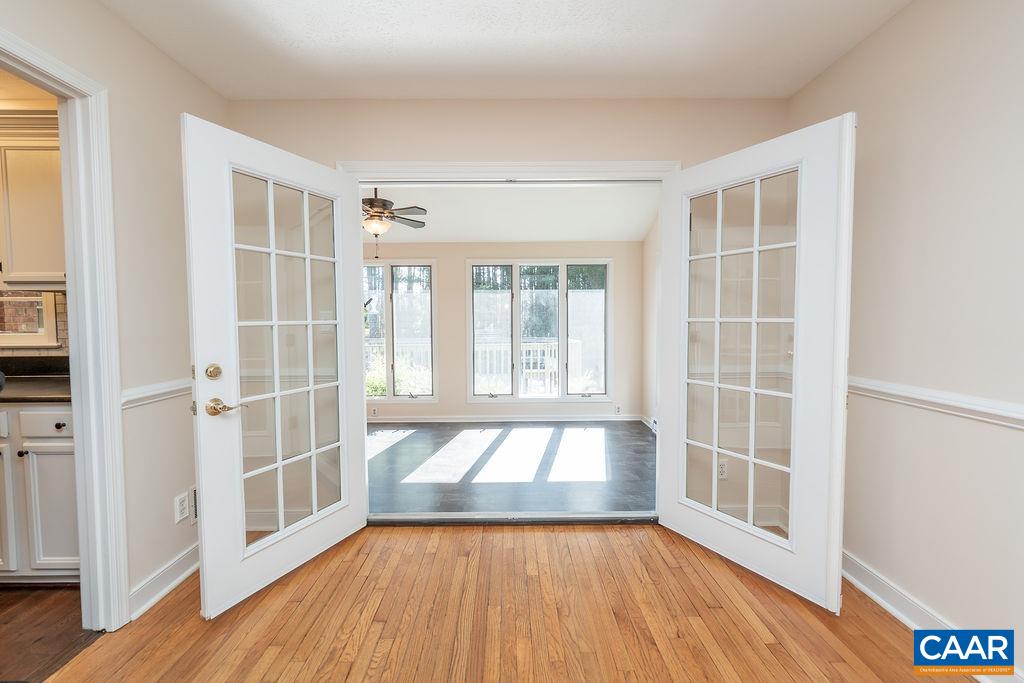 6156 Advance Mills Road Ruckersville, VA 22968 - Photo 5 of 54 a view of an empty room with wooden floor and a window