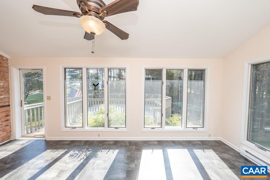 6156 Advance Mills Road Ruckersville, VA 22968 - Photo 6 of 54 a view of an empty room with wooden floor and a window