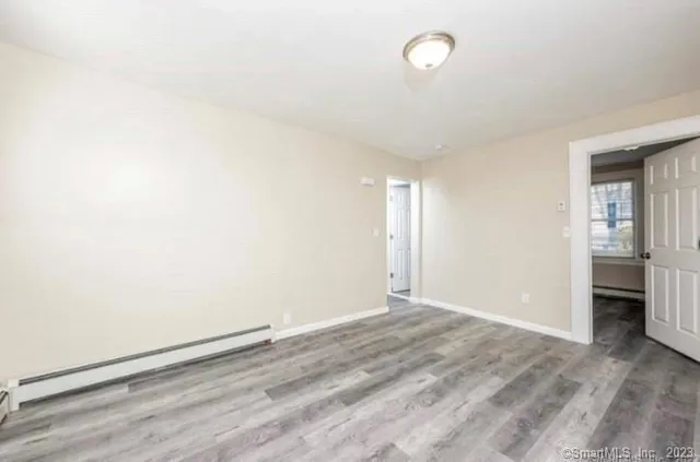 an empty room with a empty space and windows